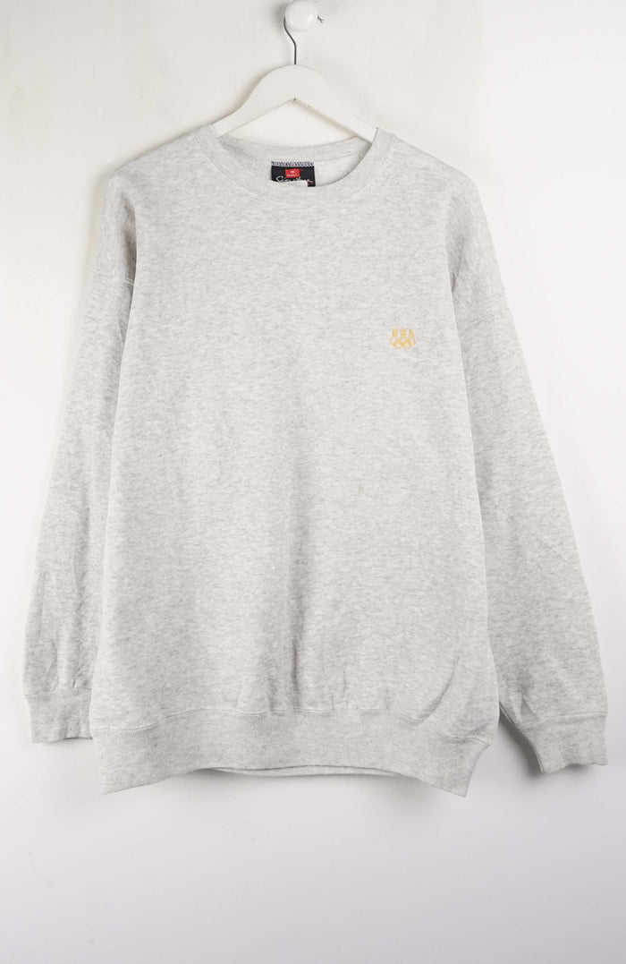 Gray sweatshirt with brand logos on a white background