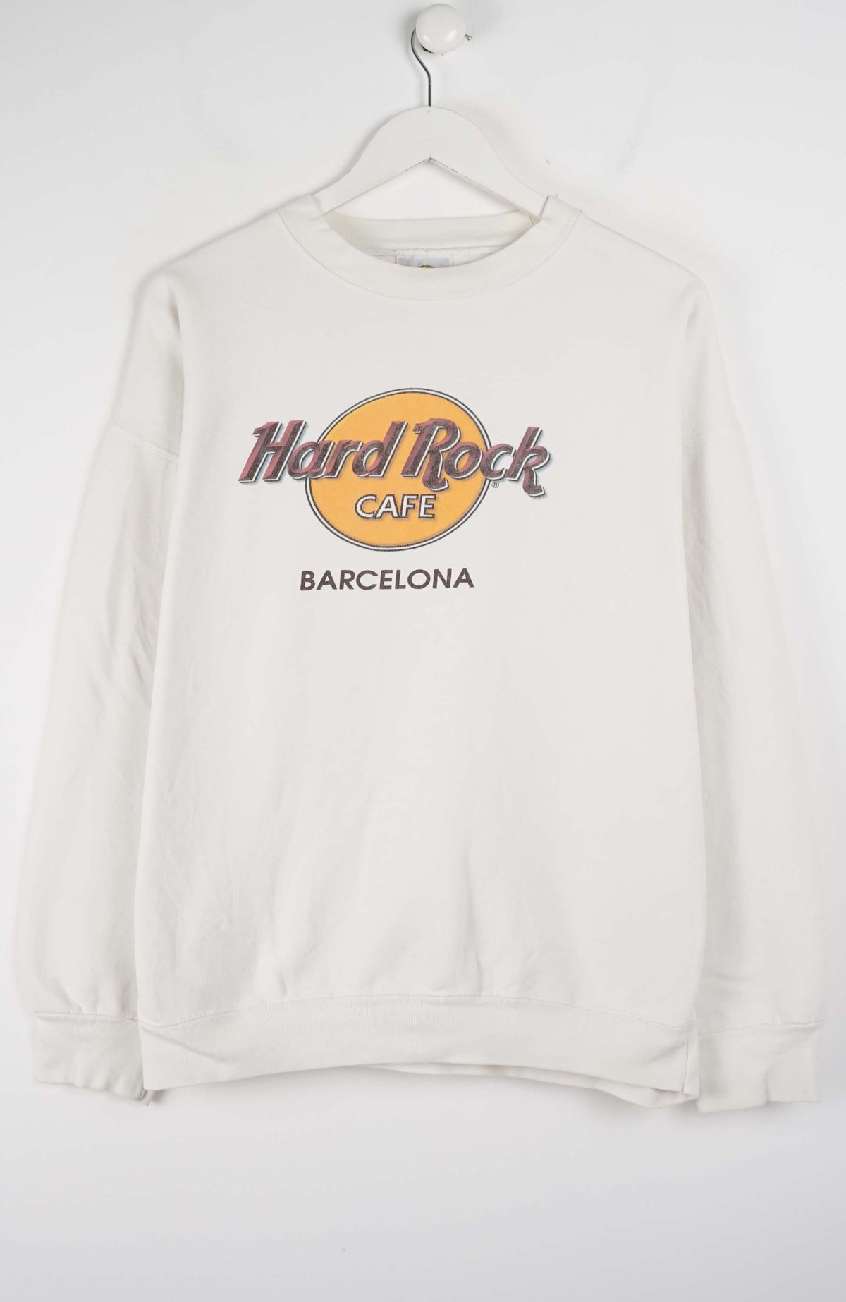 White sweatshirt with Hard Rock Cafe Barcelona logo on a white background