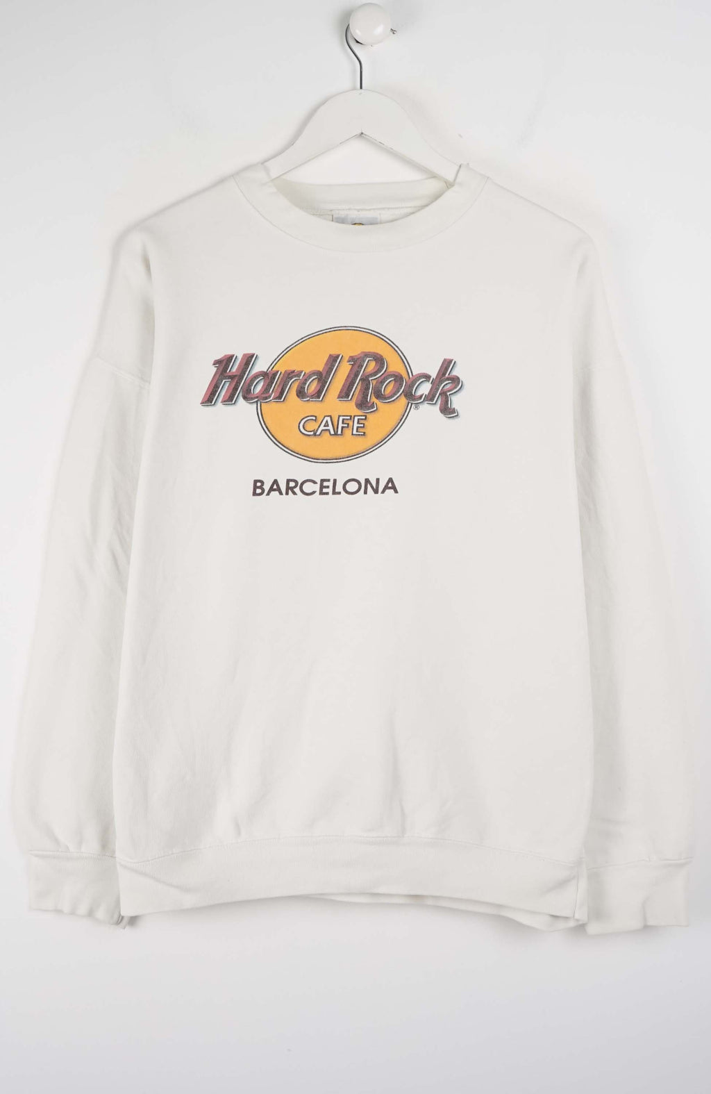 White sweatshirt with Hard Rock Cafe Barcelona logo on a white background