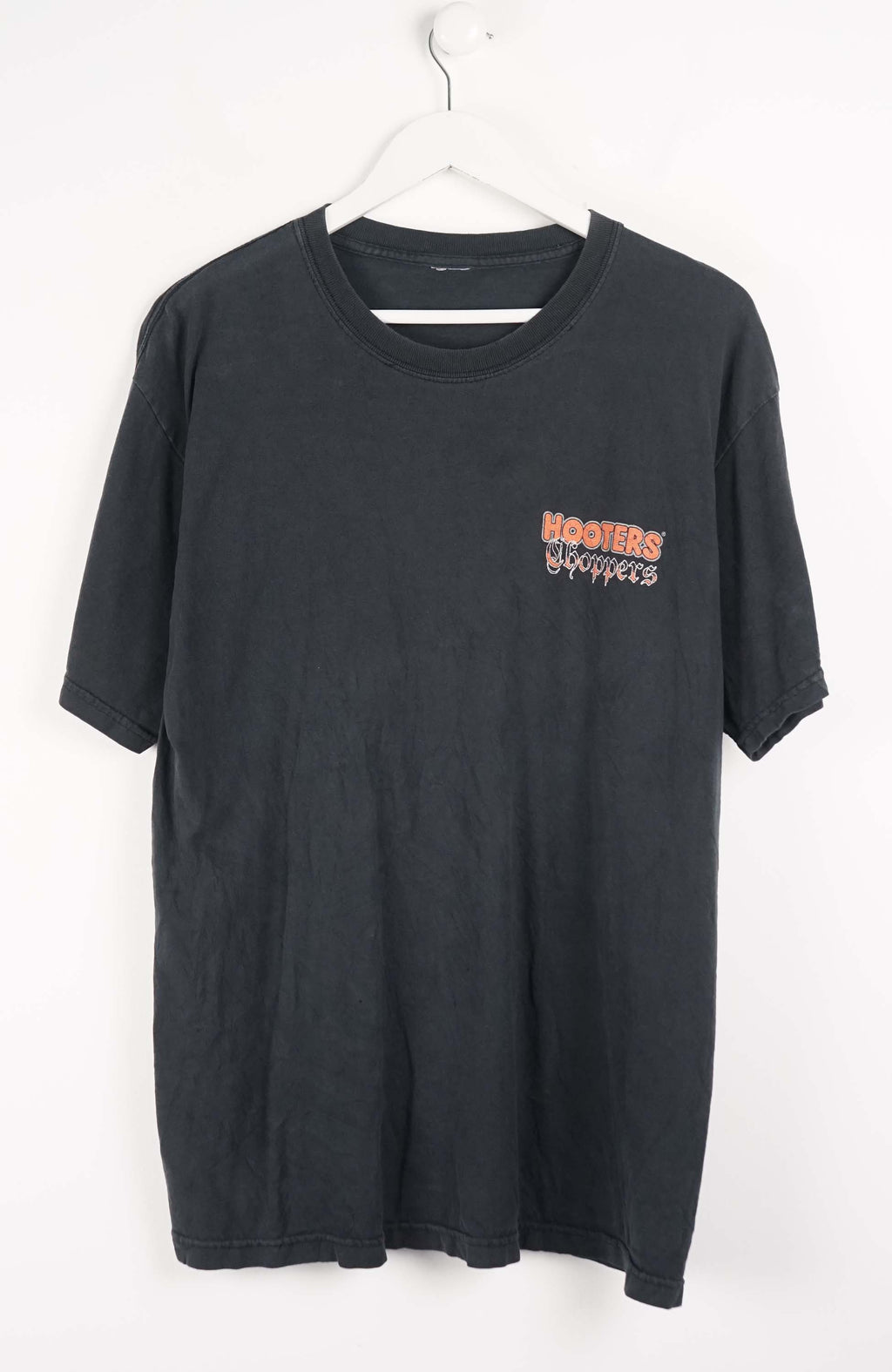 Black t-shirt with text on a white background