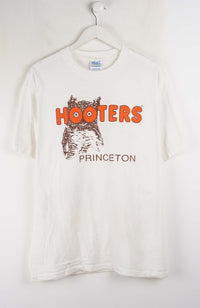 White t-shirt with 'Hooters Princeton' logo on a white background