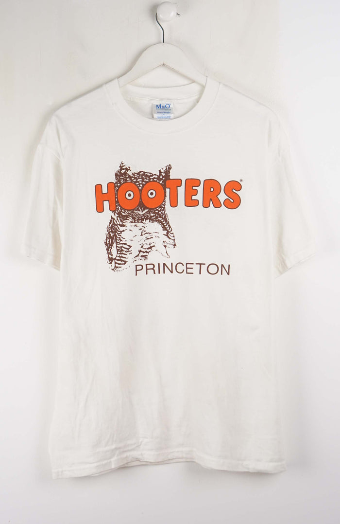 White t-shirt with 'Hooters Princeton' logo on a white background