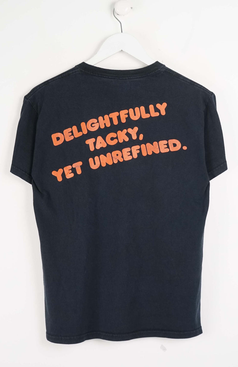Black t-shirt with orange text on a white background