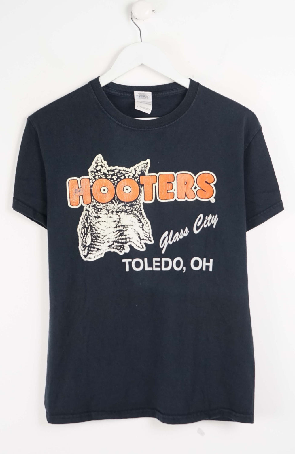 Black t-shirt with Hooters logo and text on a white background
