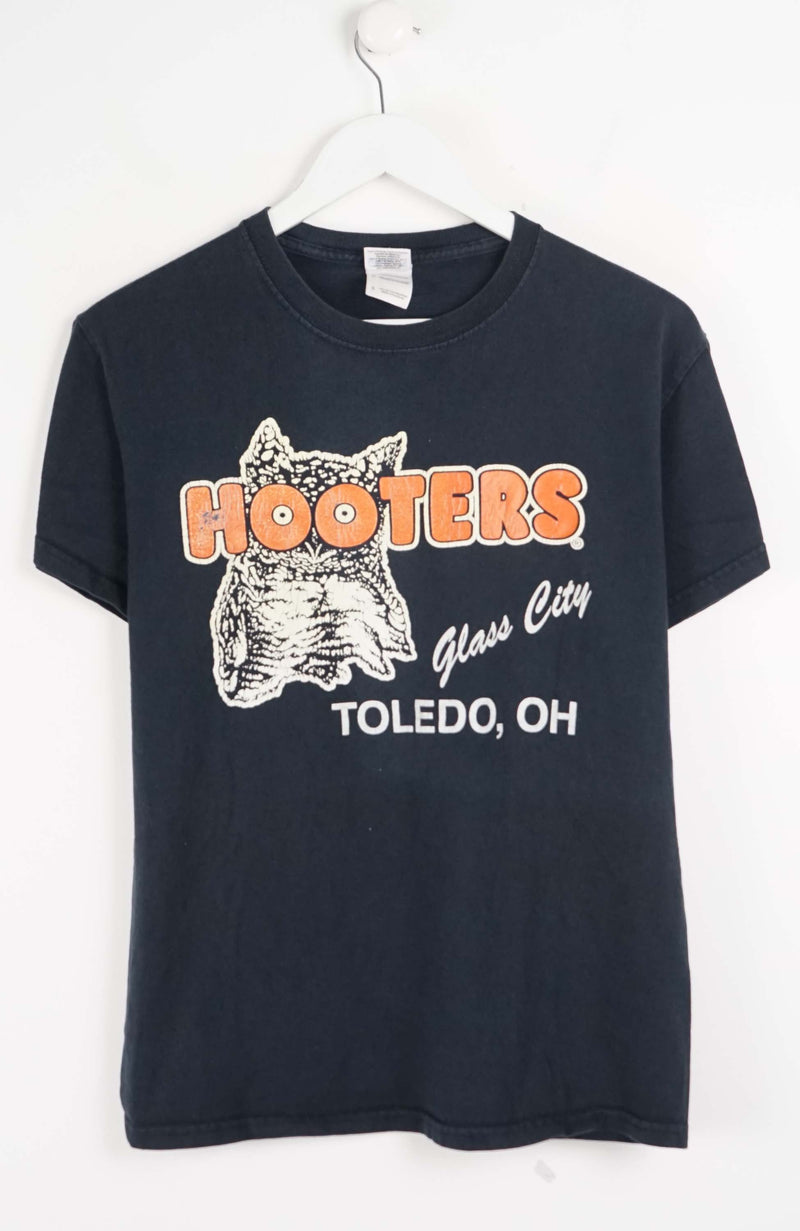 Black t-shirt with Hooters logo and text on a white background