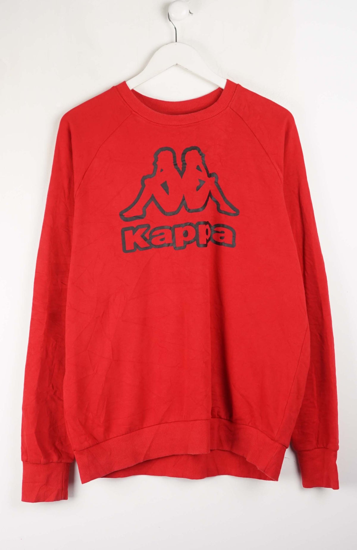 Red Kappa sweatshirt on a white hanger against a white background