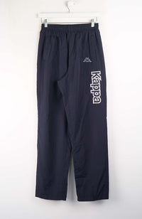 Navy blue pants with 'Kappa' logo on a white background