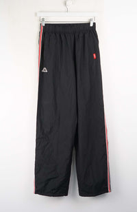Black pants with red and white stripes on a white background