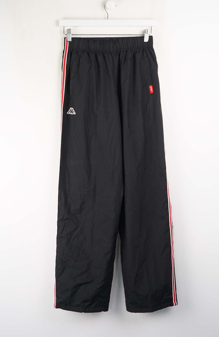 Black pants with red and white stripes on a white background