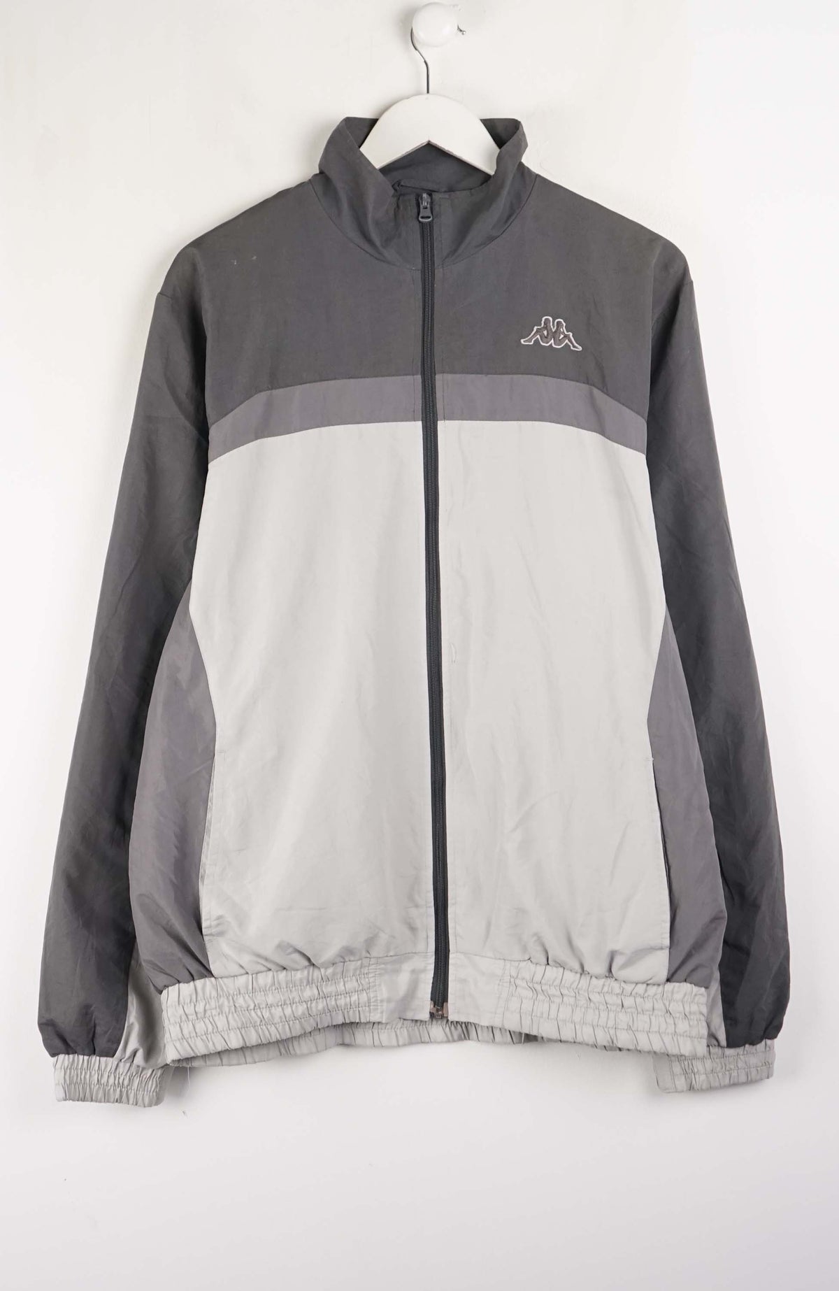 Gray and white jacket with a brand logo on a white background