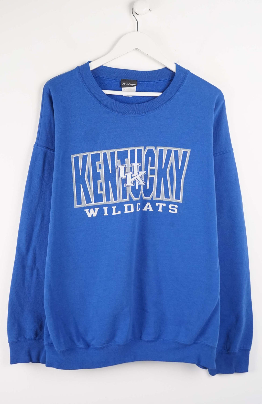 Blue sweatshirt with 'Kentucky Wildcats' text on a white background