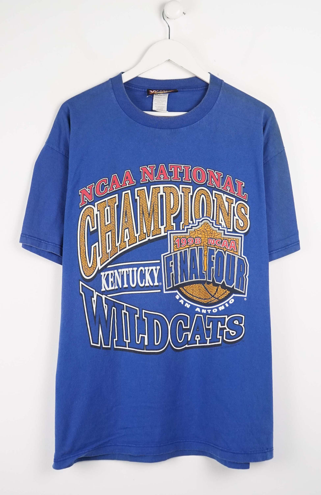 Blue t-shirt with 'NCAA National Champions Kentucky Wildcats' text on a white background