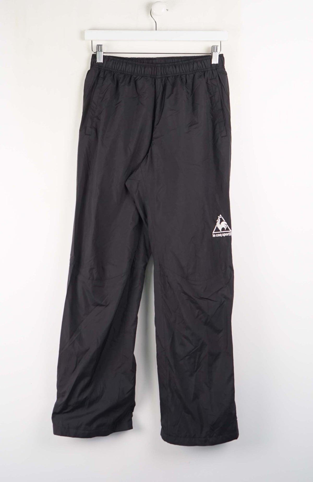 Black pants with a logo on a white background
