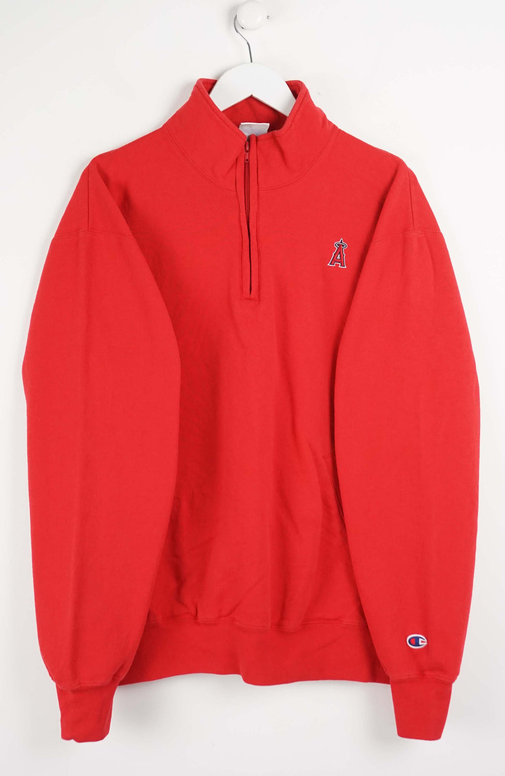 Red sweatshirt with a small logo on a white background