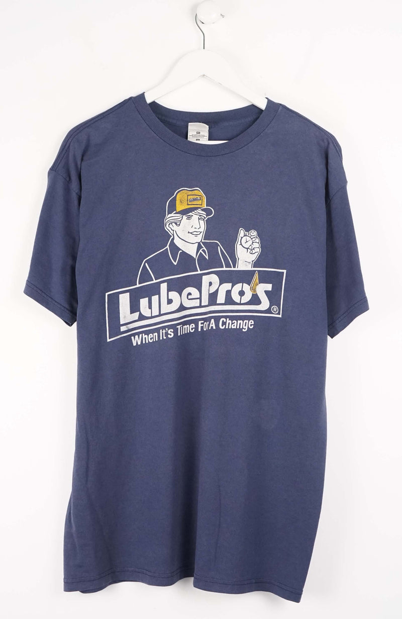 Blue t-shirt with Lube Pro's logo on a white background
