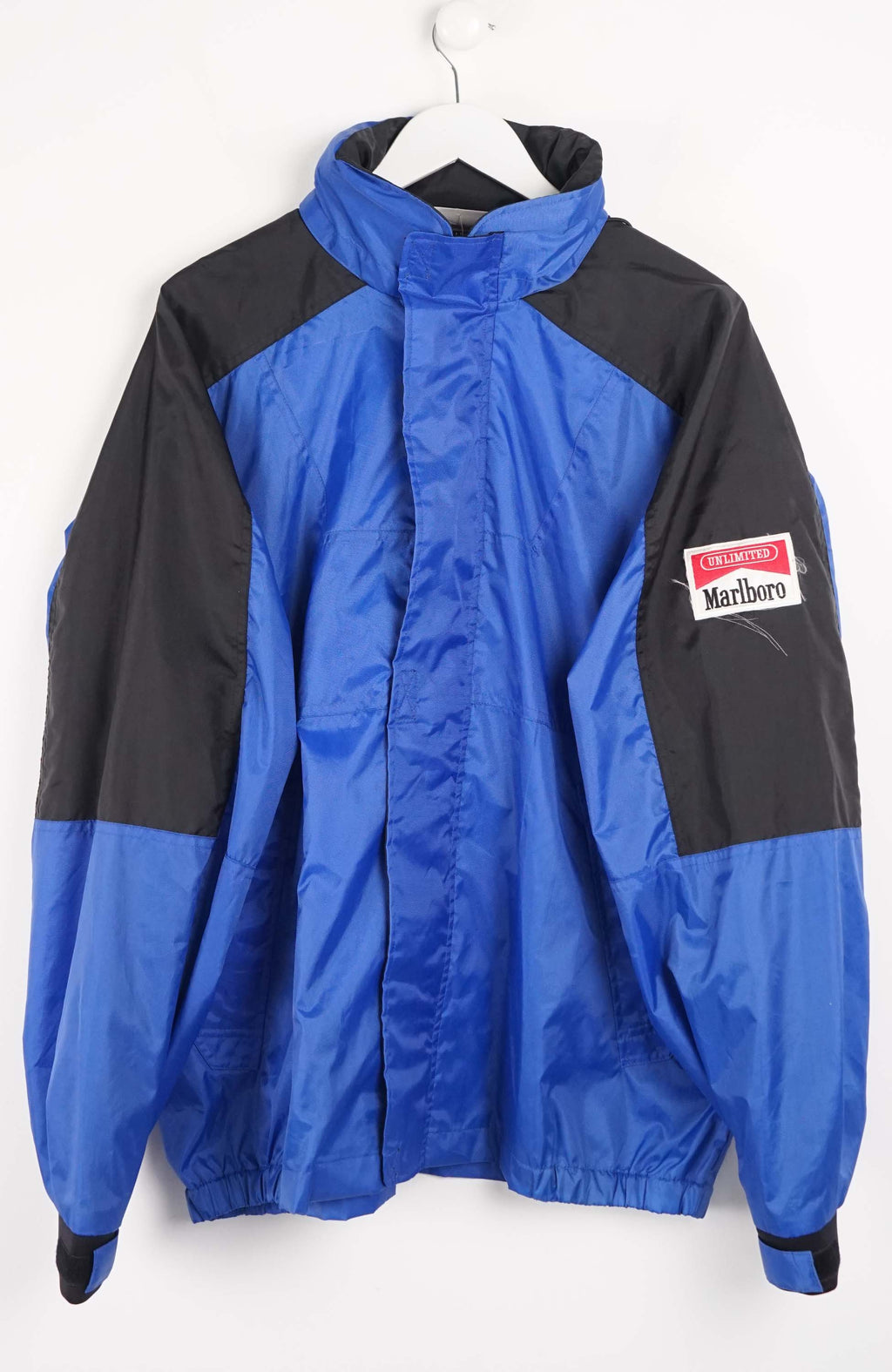 Blue and black jacket with a visible brand logo on a white background