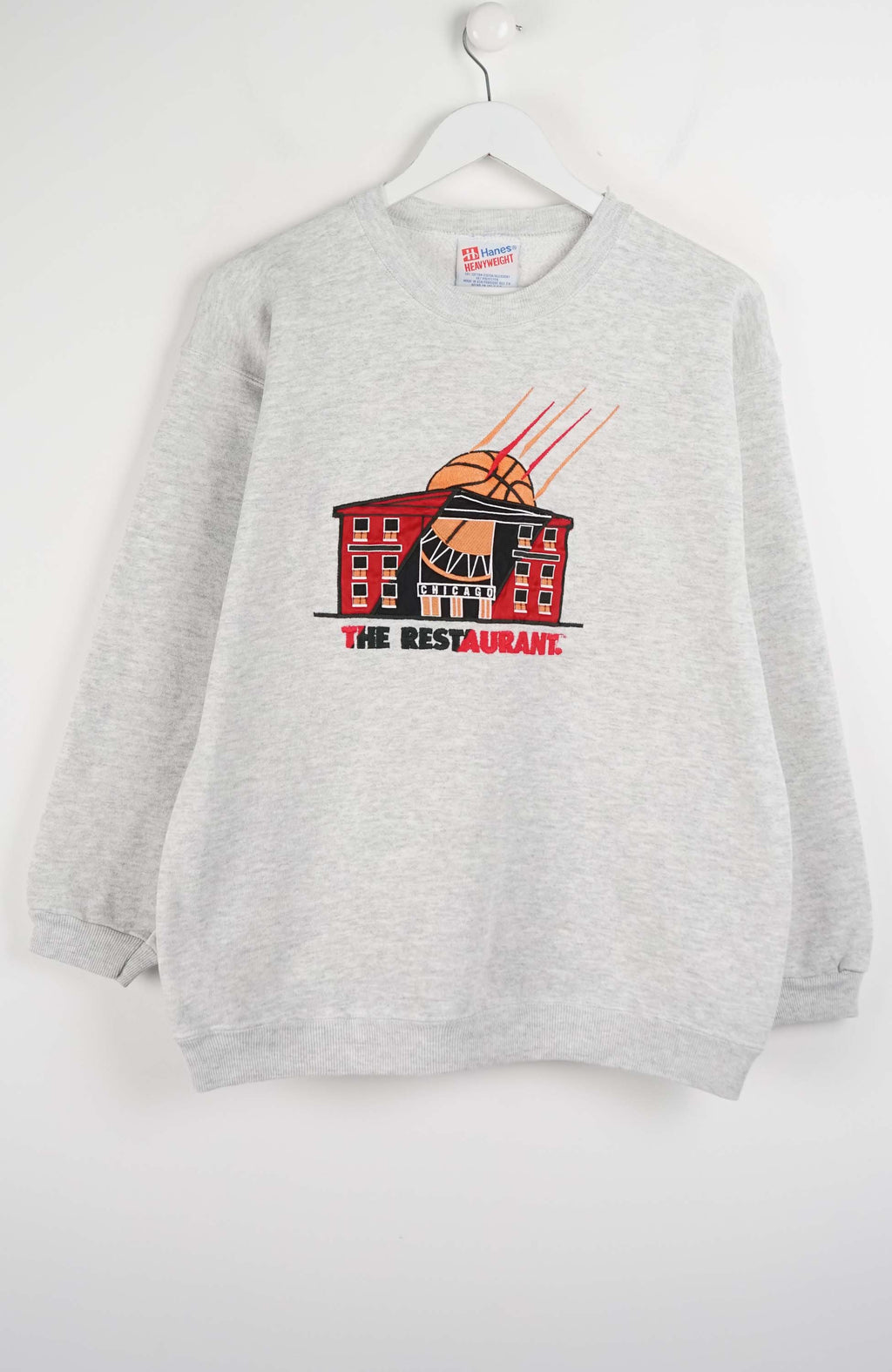 Gray sweatshirt with a graphic design on a white background
