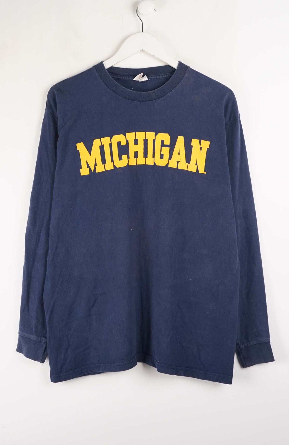 Navy long-sleeve shirt with 'MICHIGAN' in yellow on a white background