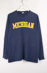 Navy long-sleeve shirt with 'MICHIGAN' in yellow on a white background
