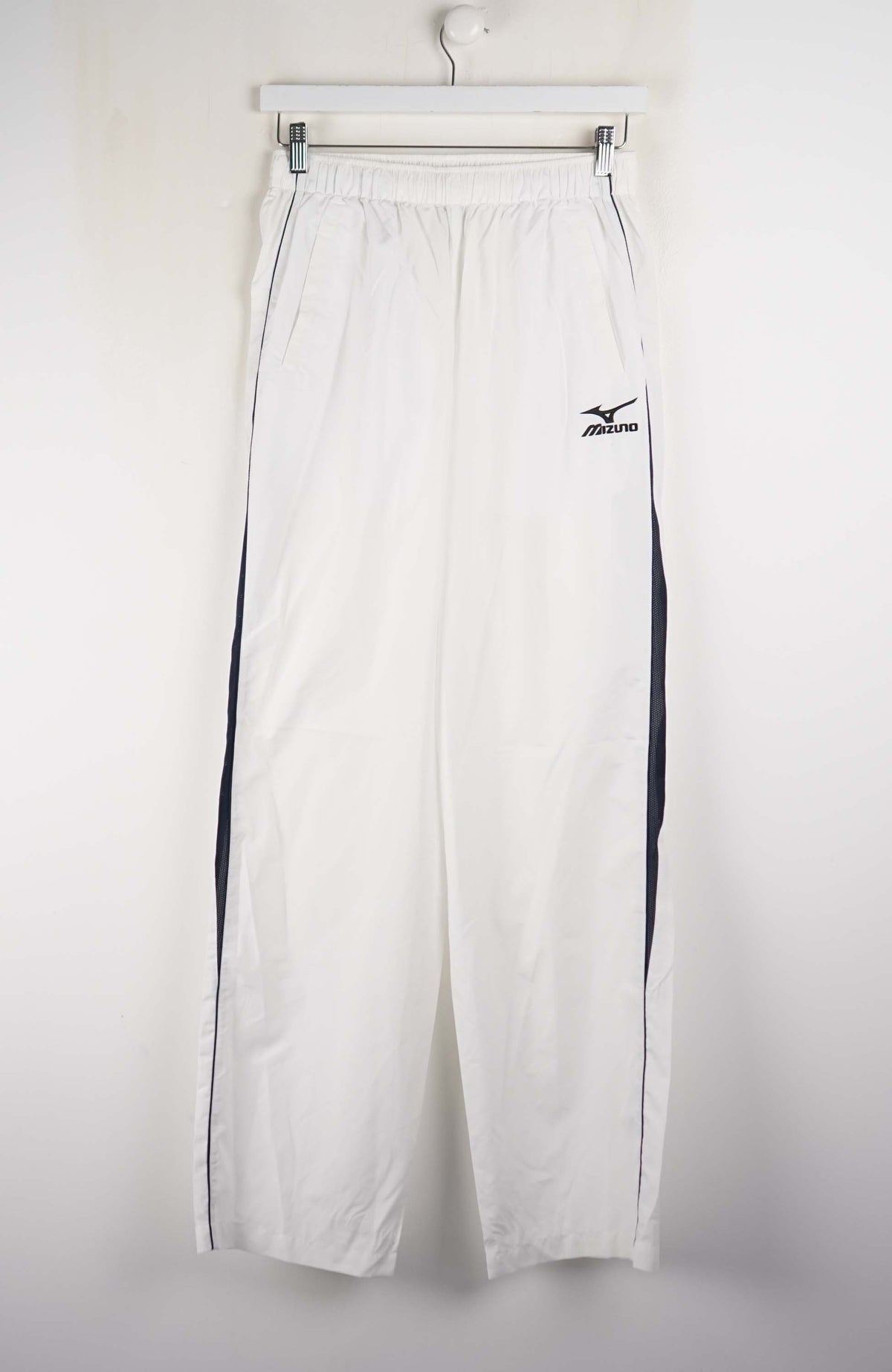 White pants with a black logo on a white background