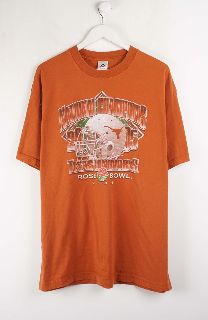 Orange t-shirt with football graphics and text on a white background
