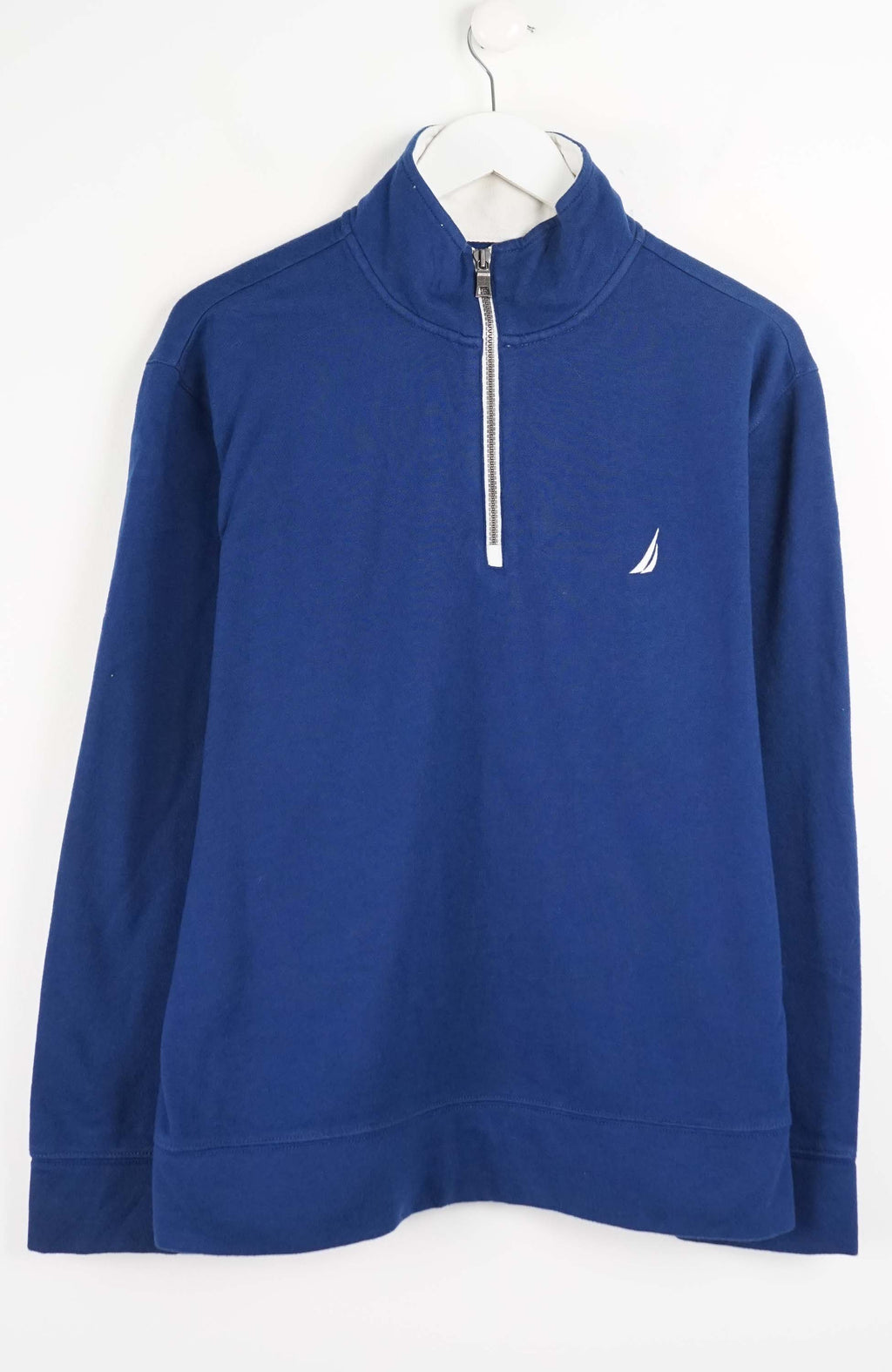 Blue pullover with a white zipper and logo on a white background