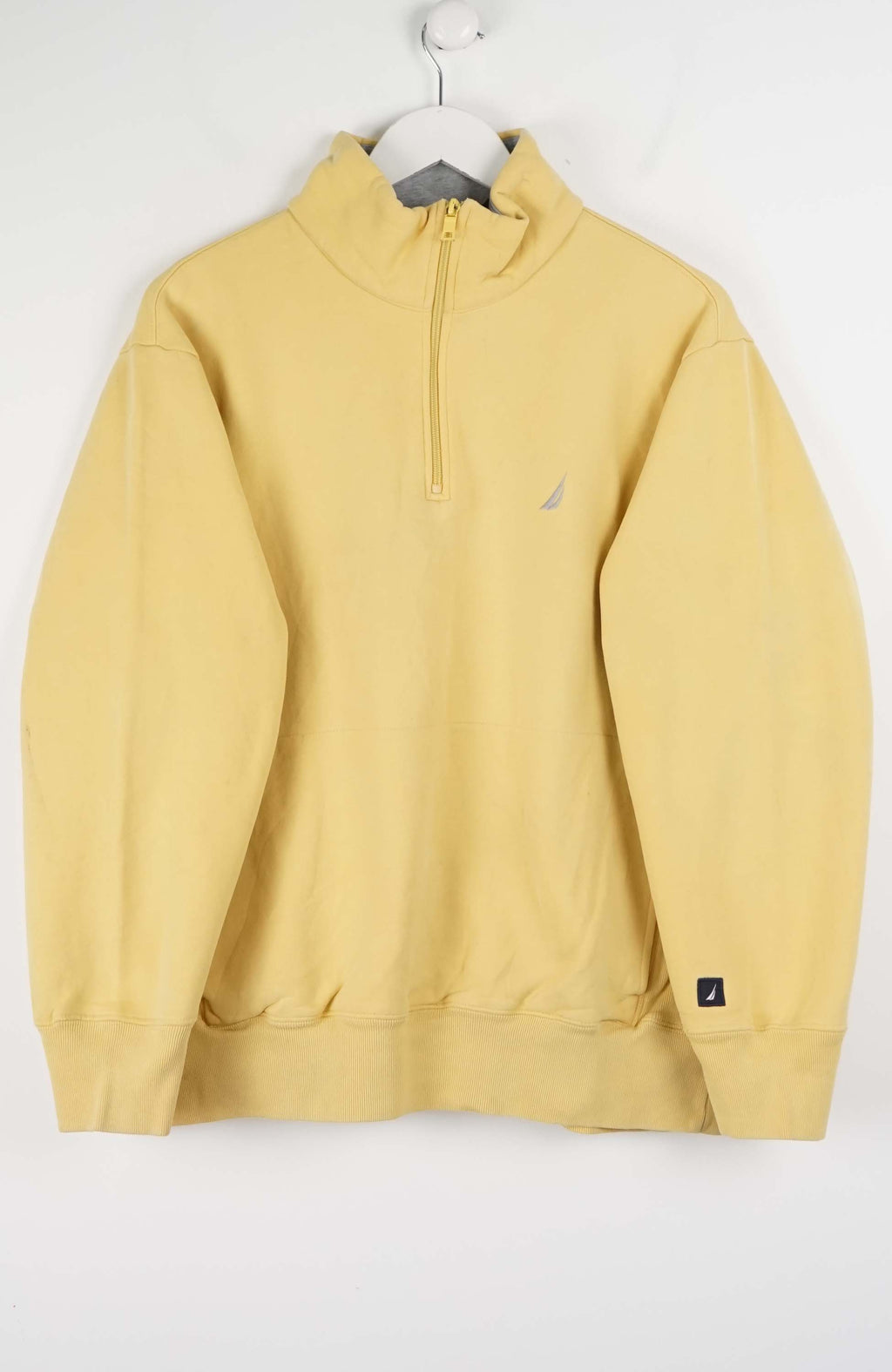 Yellow half-zip sweatshirt on a white background