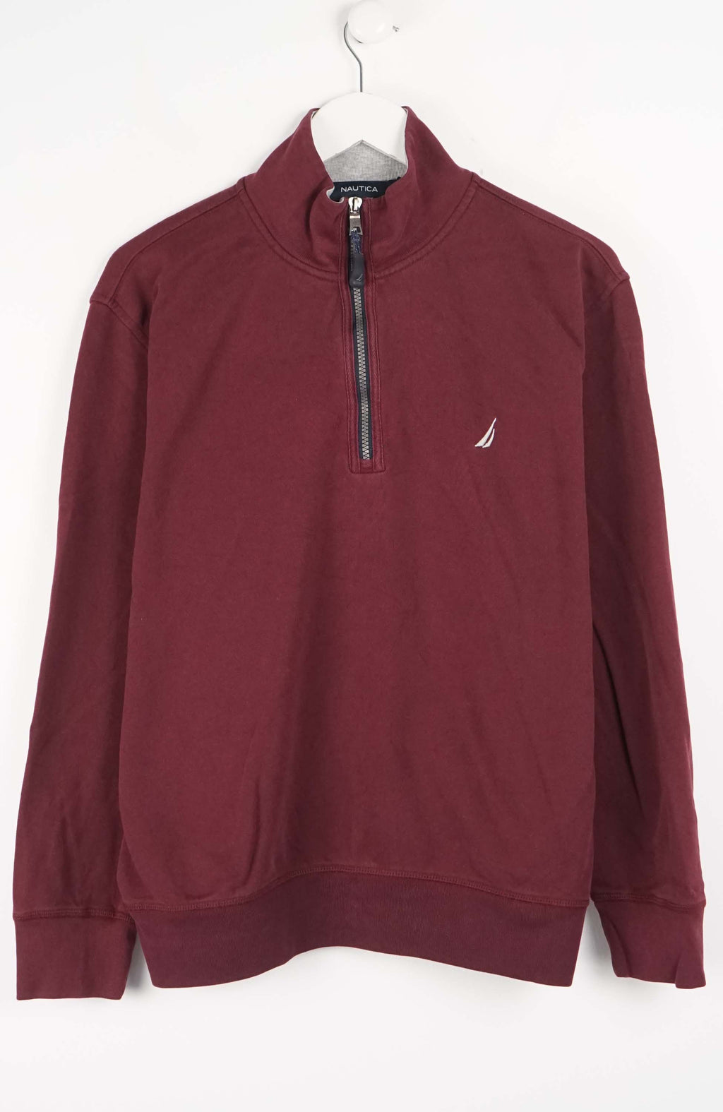 Maroon pullover with a small logo on a white background