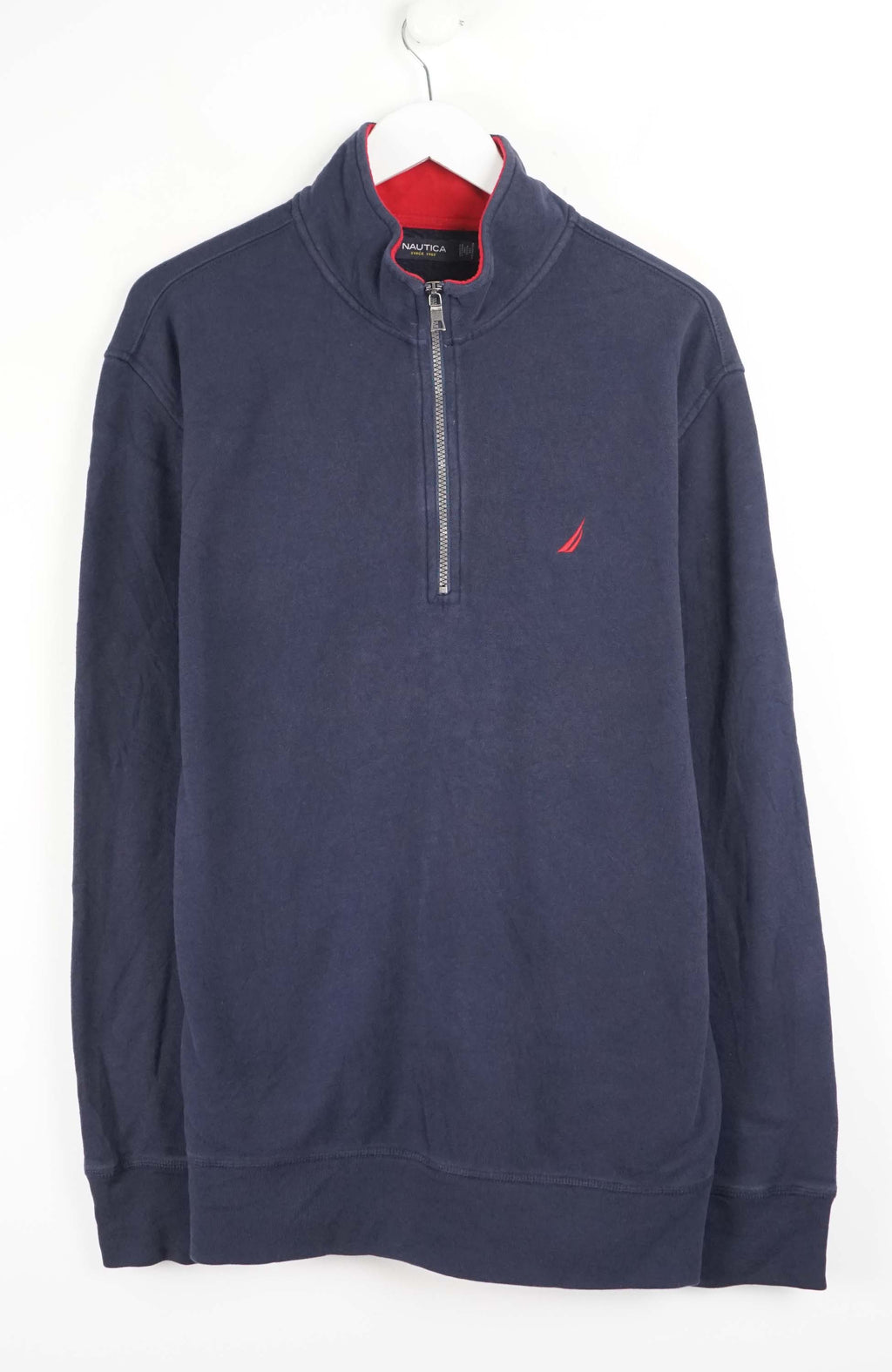 Navy blue half-zip sweatshirt with a red logo on a white background