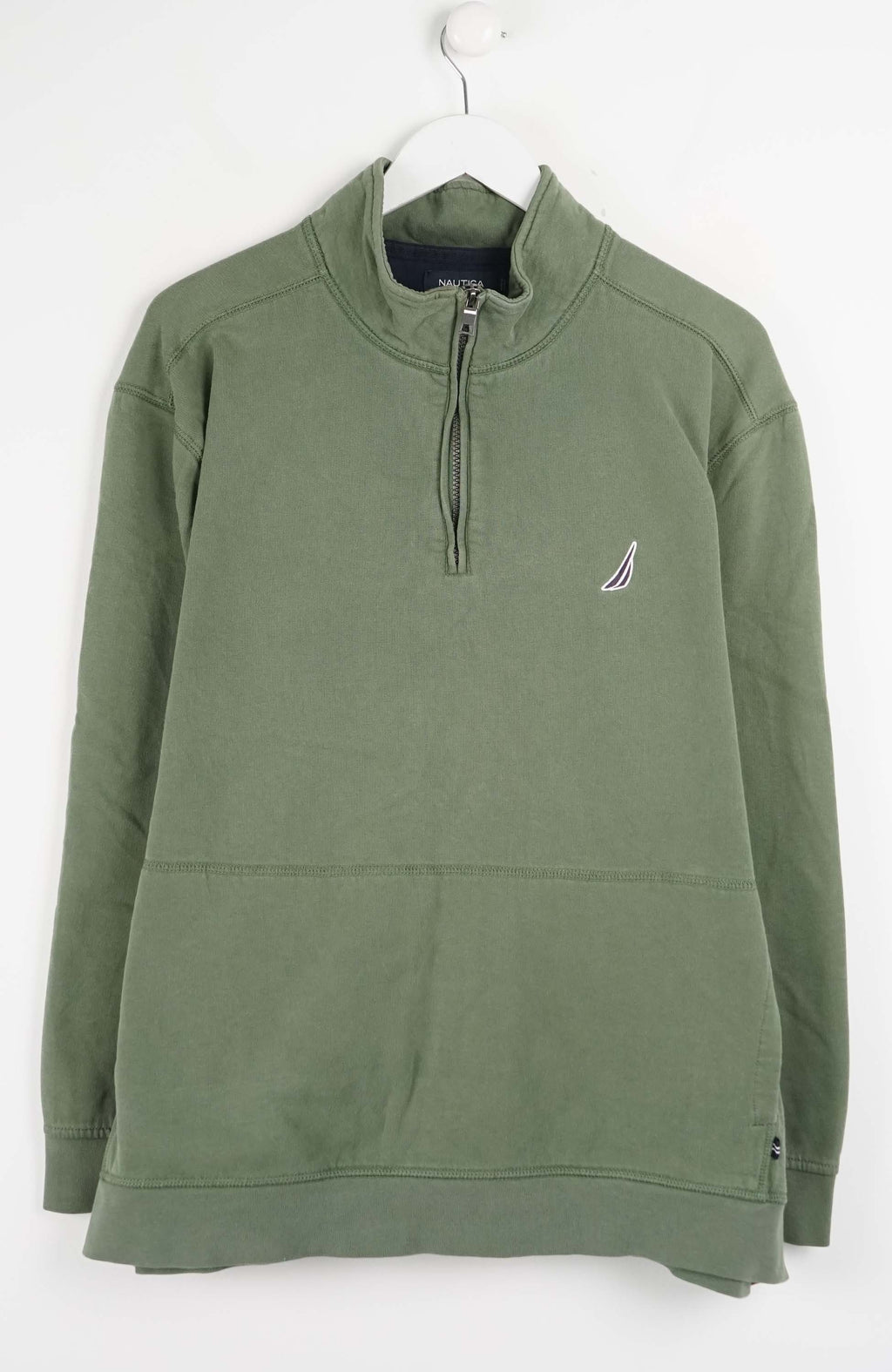 Green pullover with a small logo on a white background