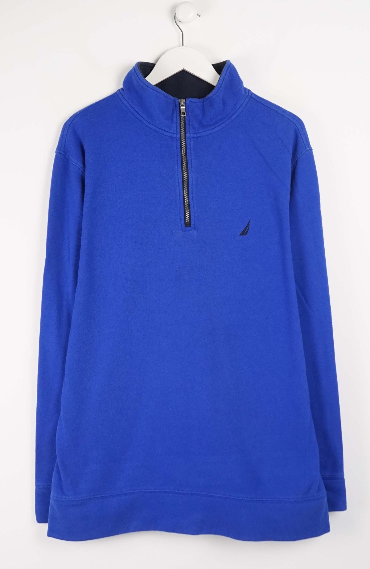 Blue pullover with a quarter zip on a white hanger