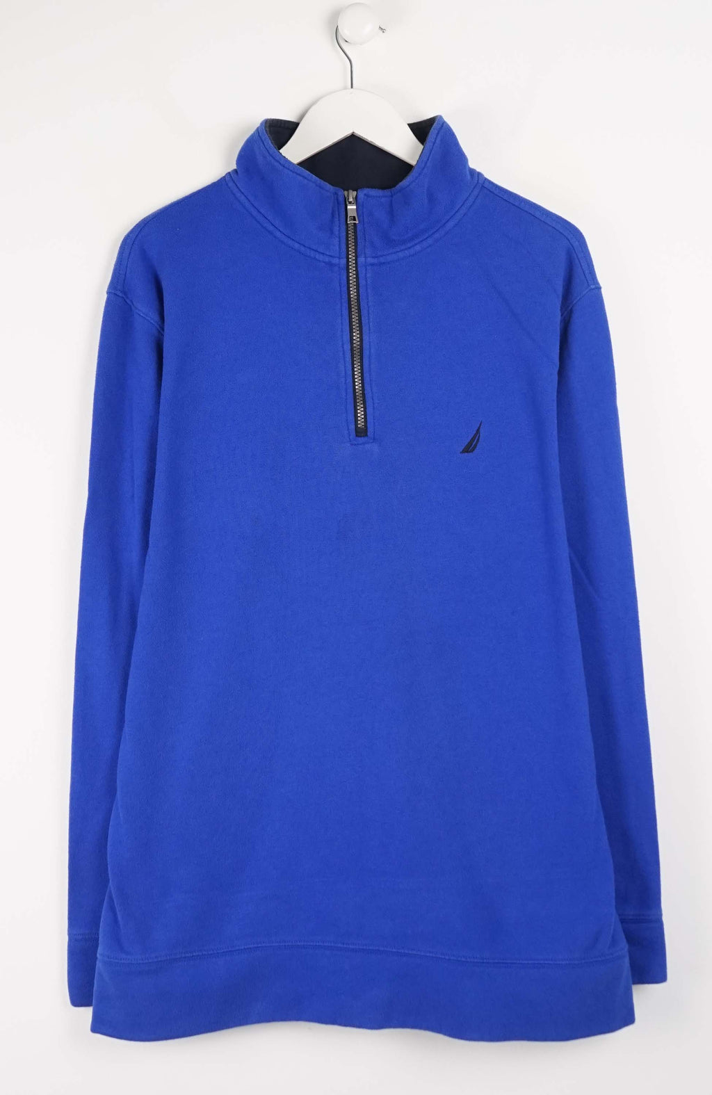 Blue pullover with a quarter zip on a white hanger