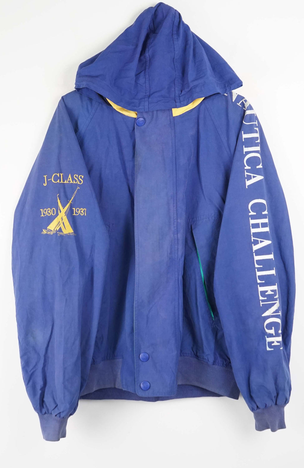 Blue jacket with yellow and white text and graphics on a white background