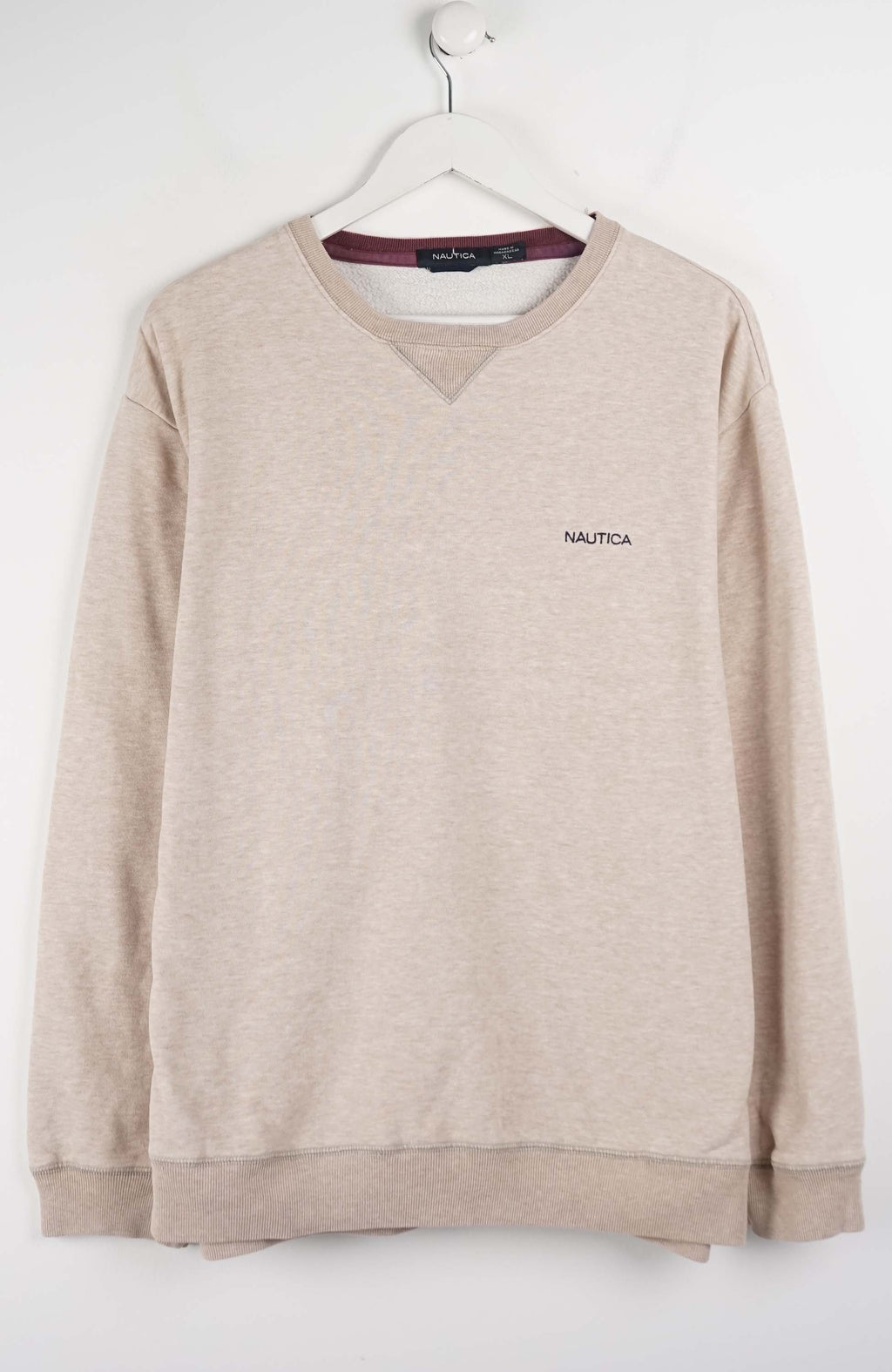 Beige sweatshirt with Nautica logo on a white background