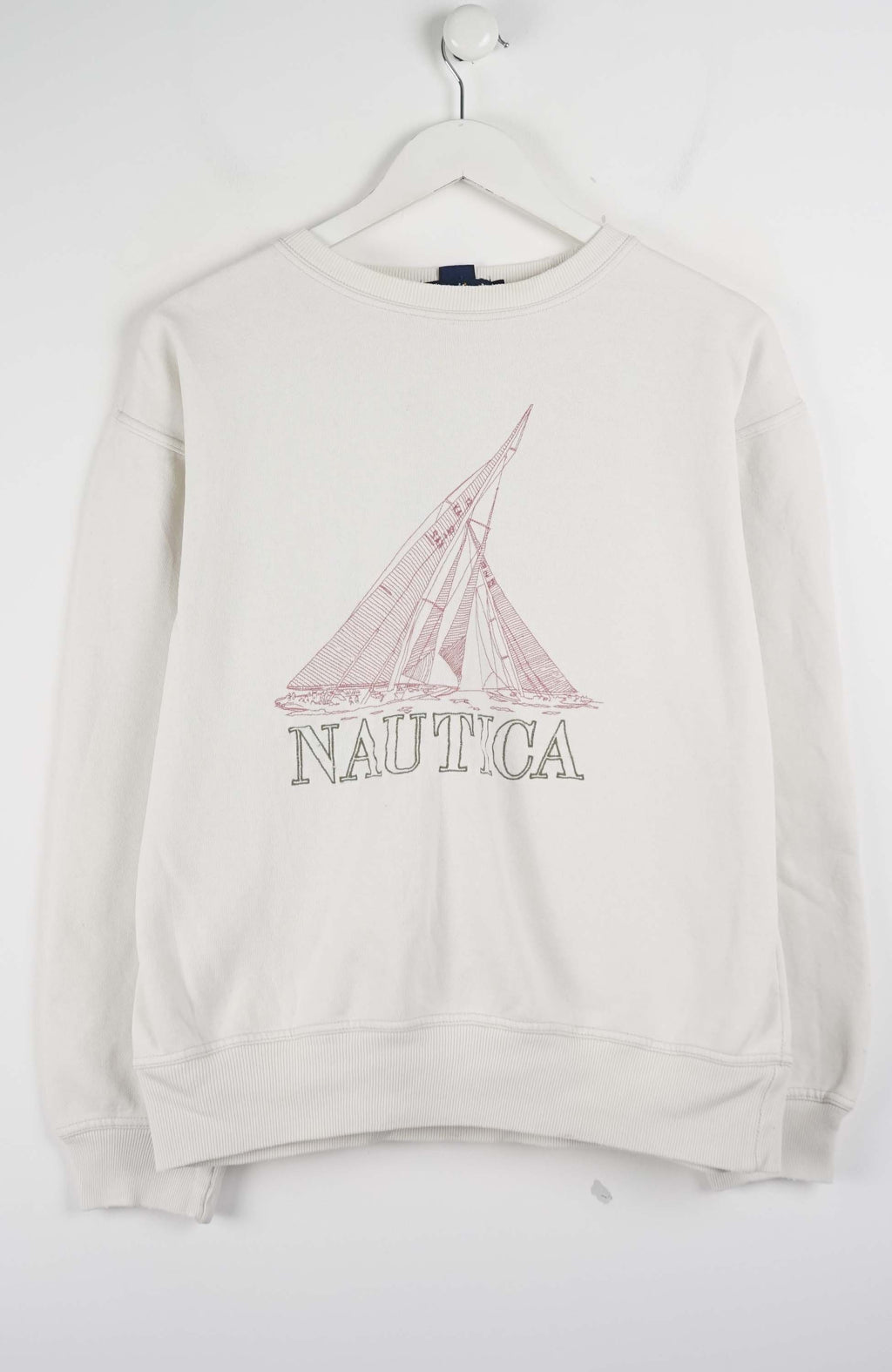 Beige Nautica sweatshirt with sailboat graphic on a white background