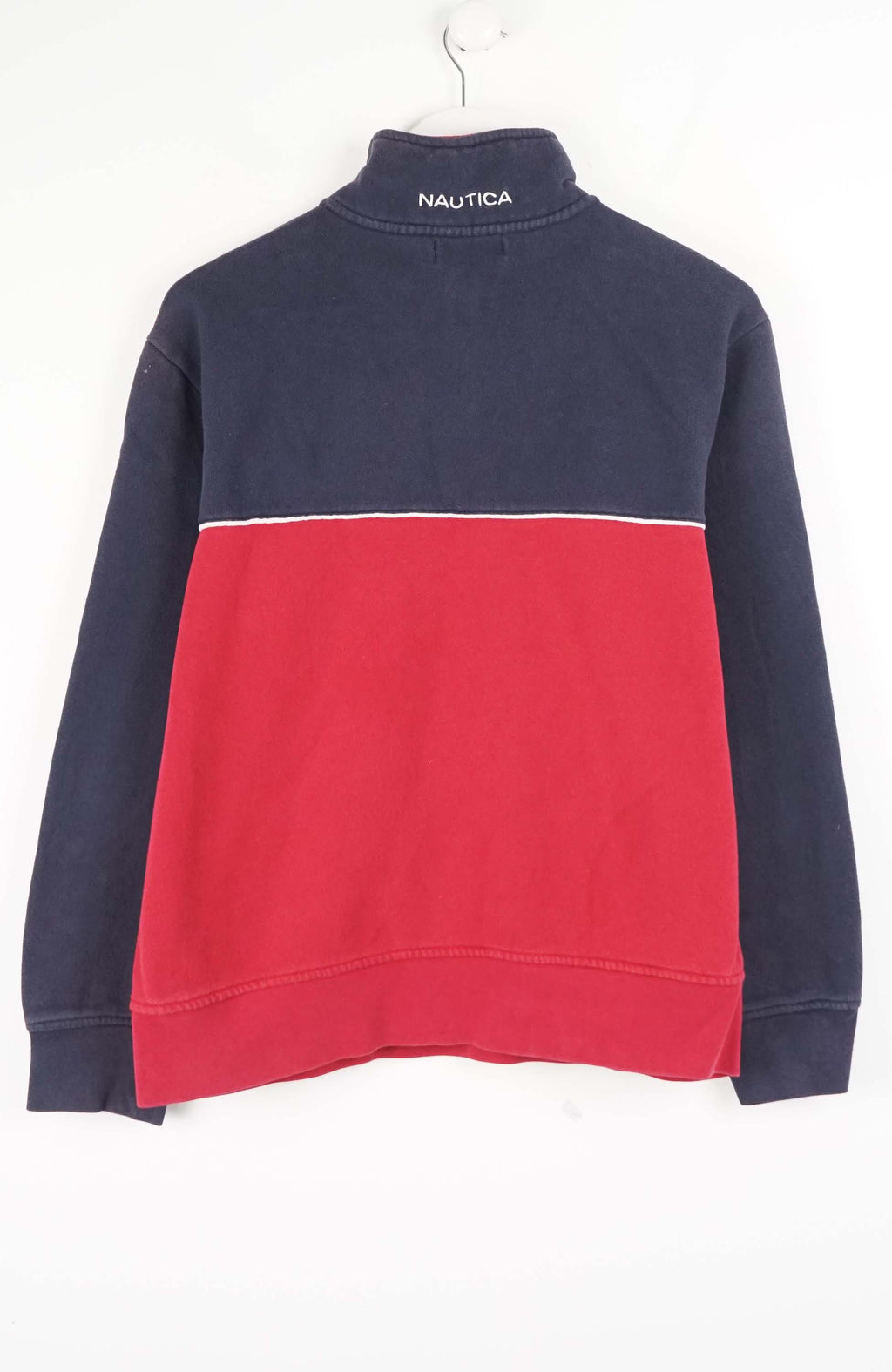 Navy and red pullover with a brand logo on a white background