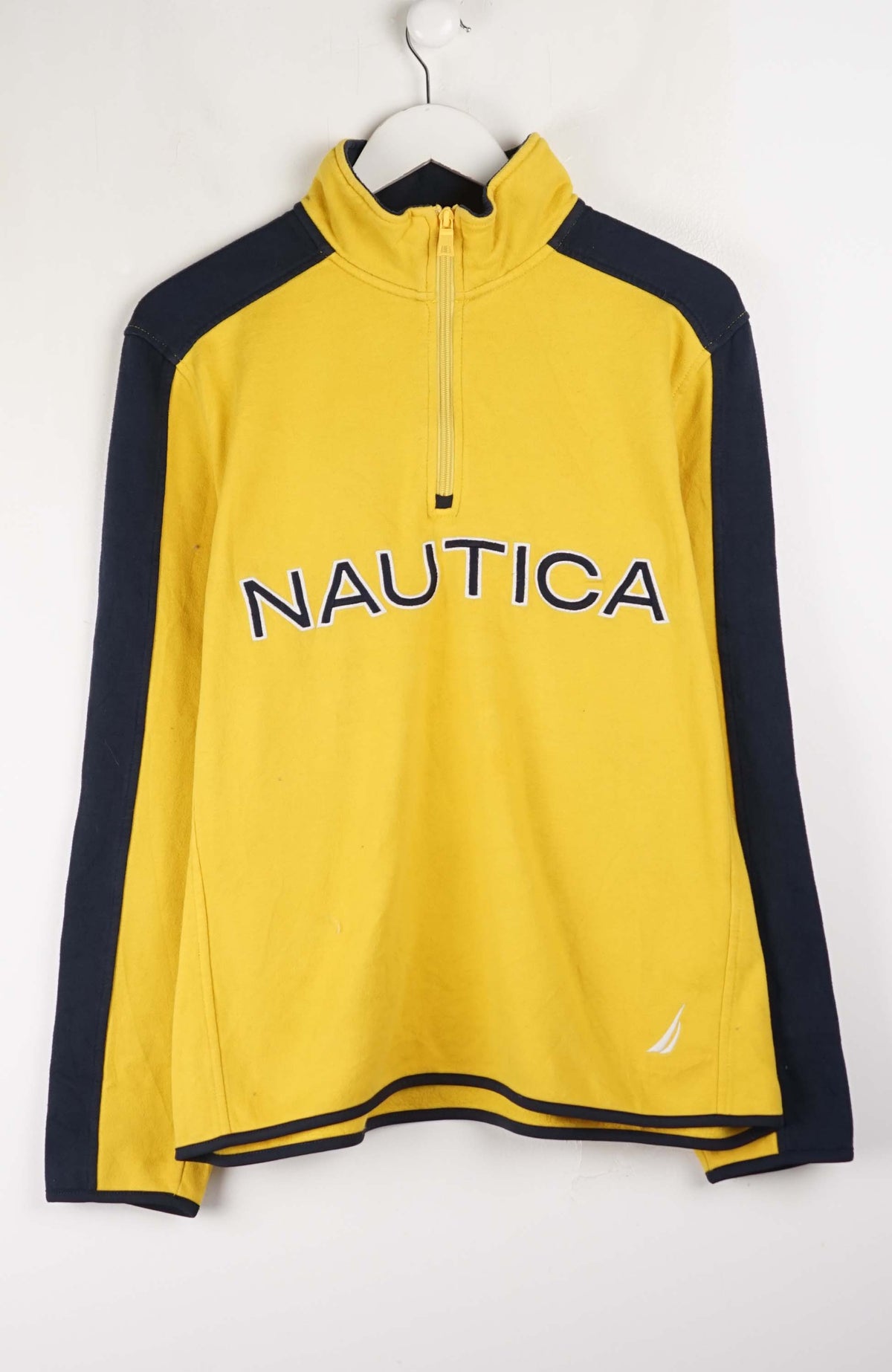 Yellow Nautica pullover with navy sleeves on a white background