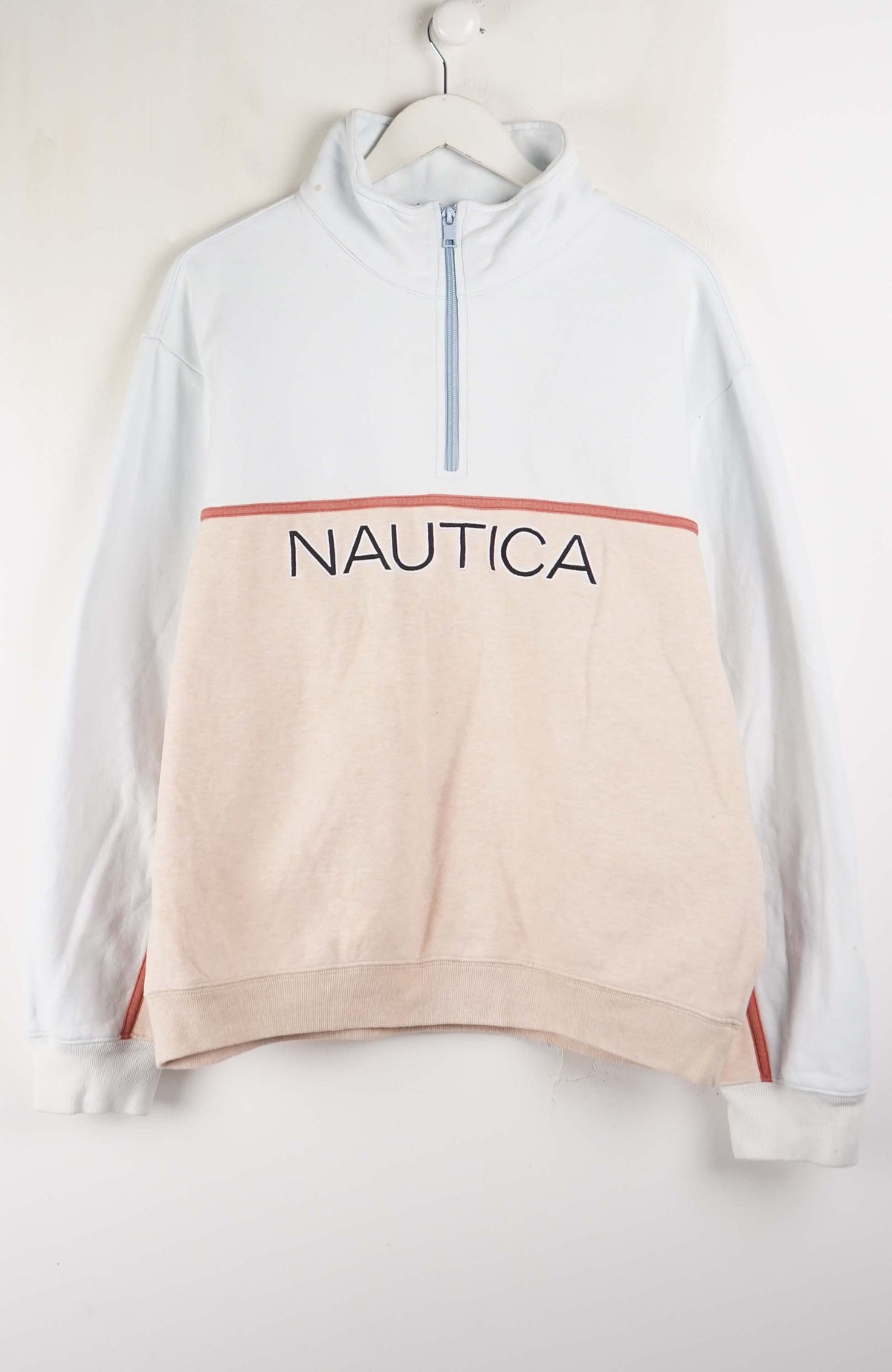 Nautica sweatshirt on a hanger against a white background