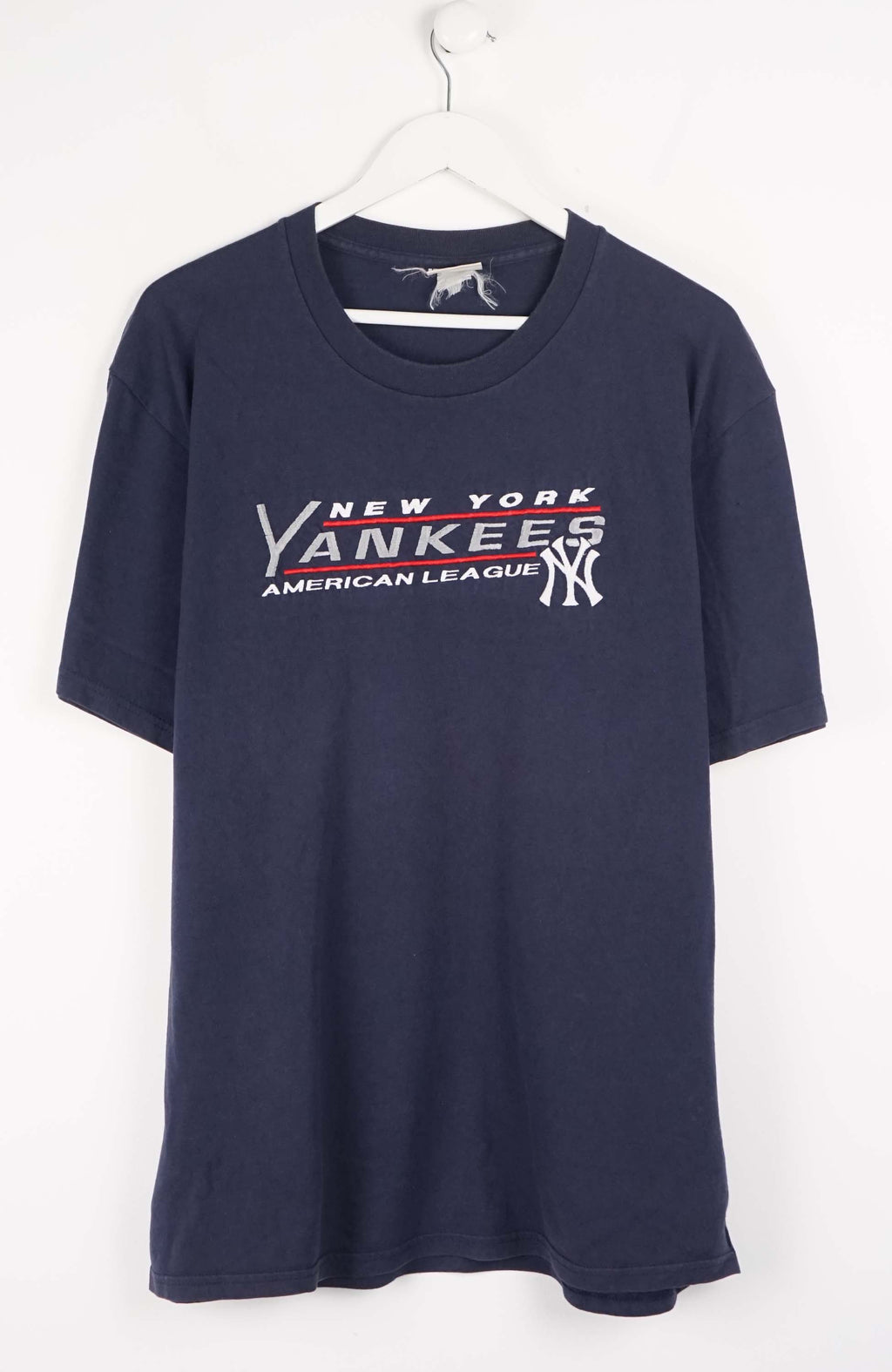Navy blue t-shirt with New York Yankees logo on a white background