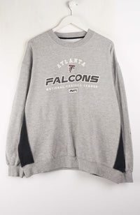 Gray sweatshirt with 'Atlanta Falcons' logo on a white background
