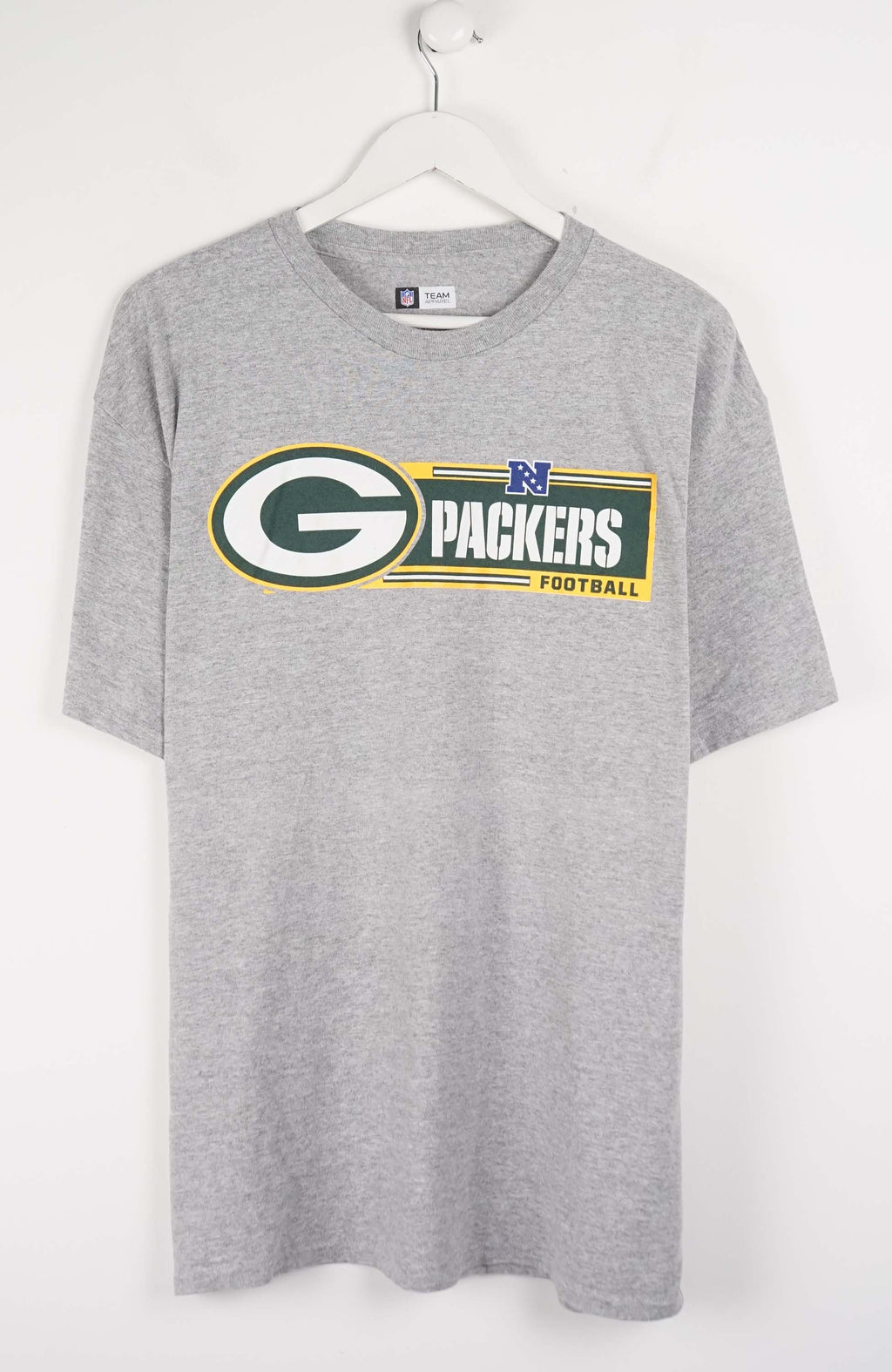 Gray t-shirt with Green Bay Packers logo on a white hanger