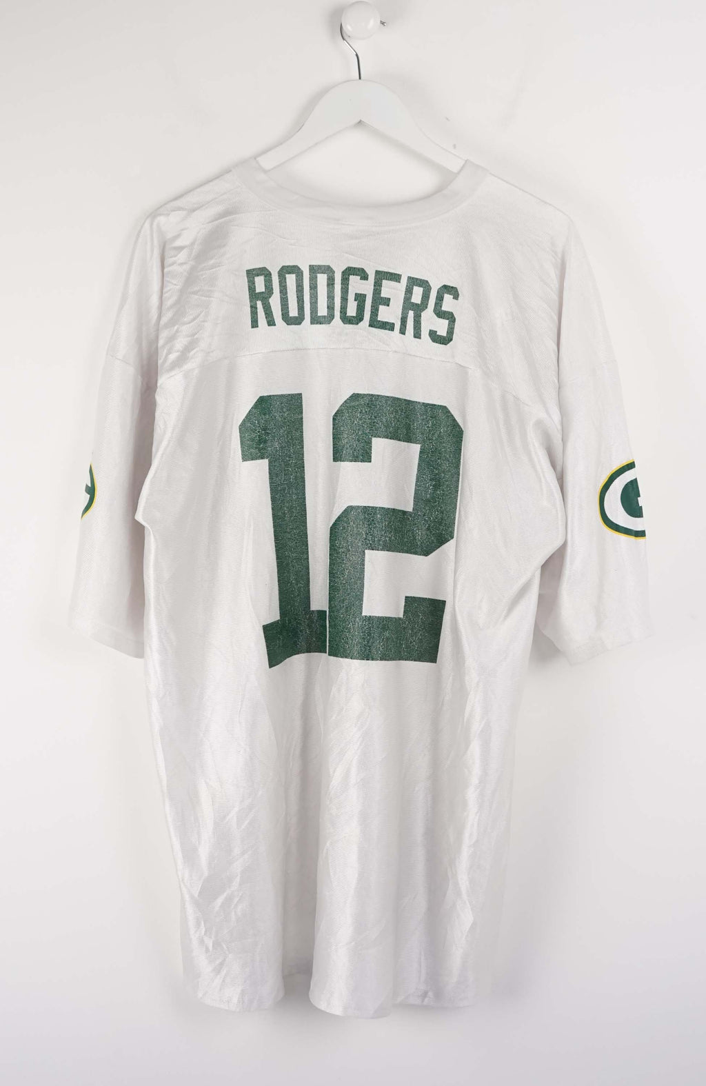 White sports jersey with number 12 and Green Bay Packers logos on a white background