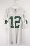 White sports jersey with number 12 and Green Bay Packers logos on a white background