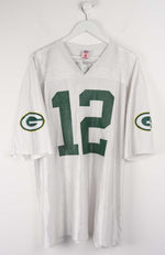 White sports jersey with number 12 and Green Bay Packers logos on a white background