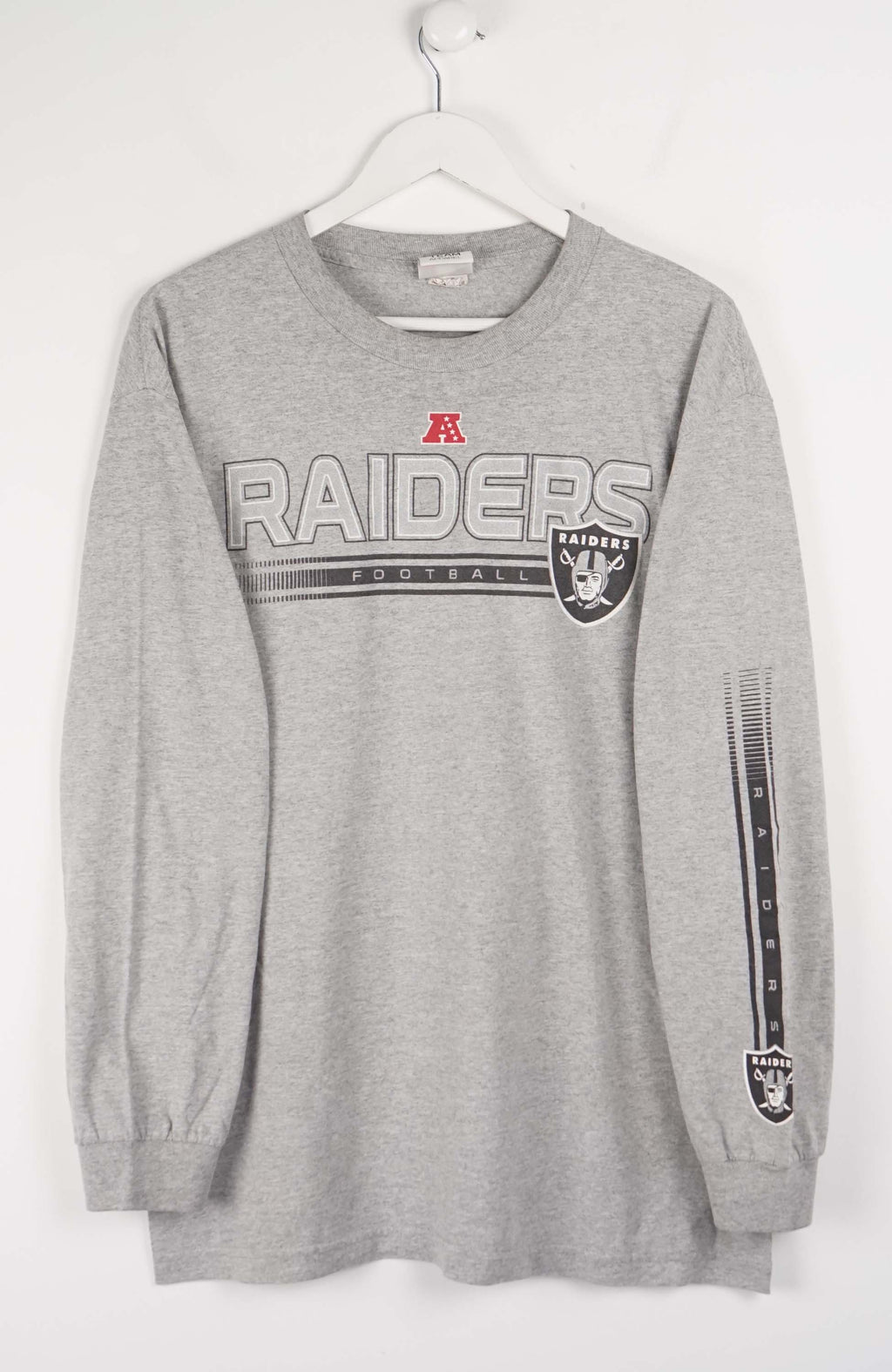 Gray long-sleeve shirt with 'Raiders' logo on a white background