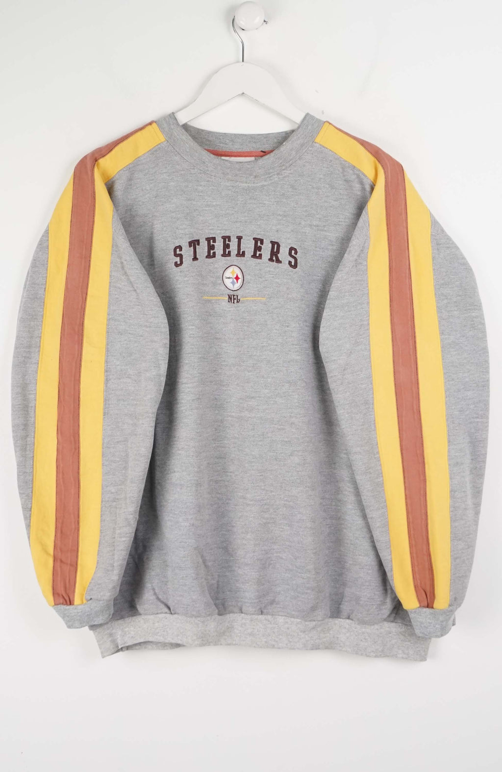 Gray sweatshirt with red and yellow stripes on sleeves, featuring 'Steelers' text and logo.