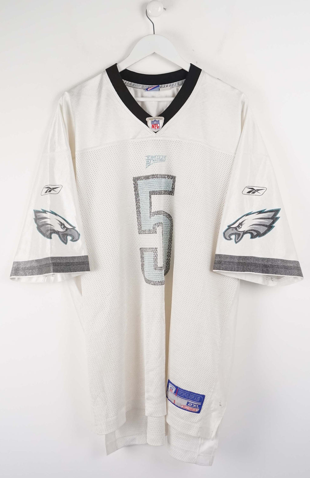White sports jersey with number 5 and team logo on a white background