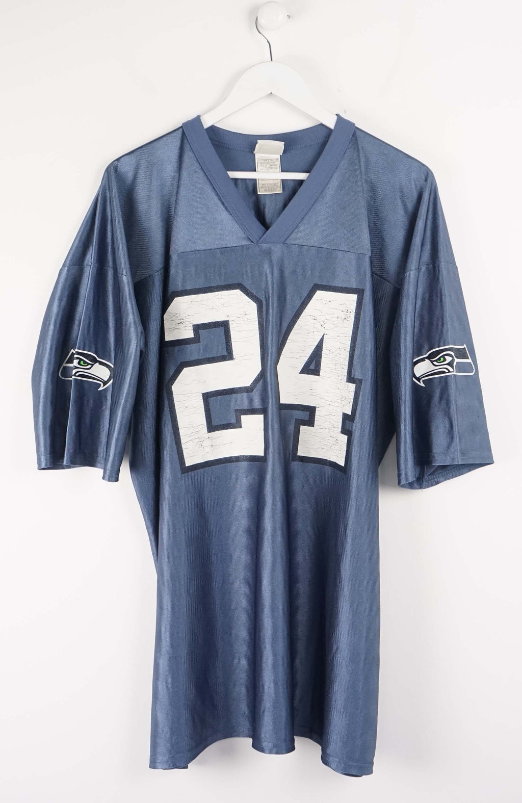 Blue sports jersey with number 24 on a white background