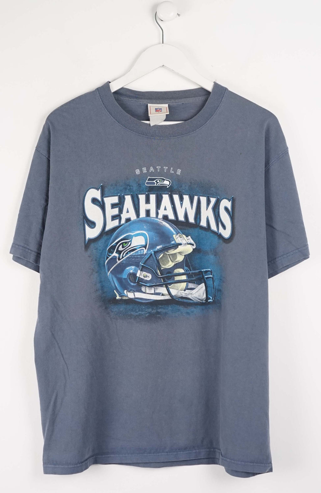 Blue t-shirt with Seattle Seahawks logo on a white background