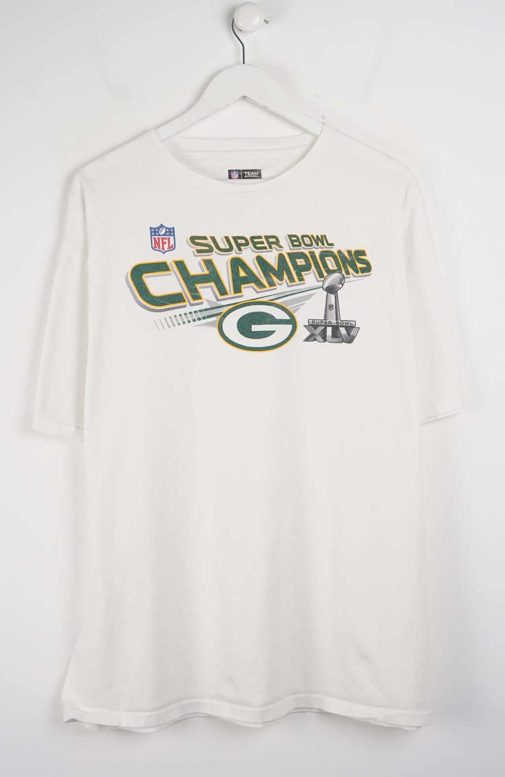 White t-shirt with Super Bowl Champions text and logo on a white background